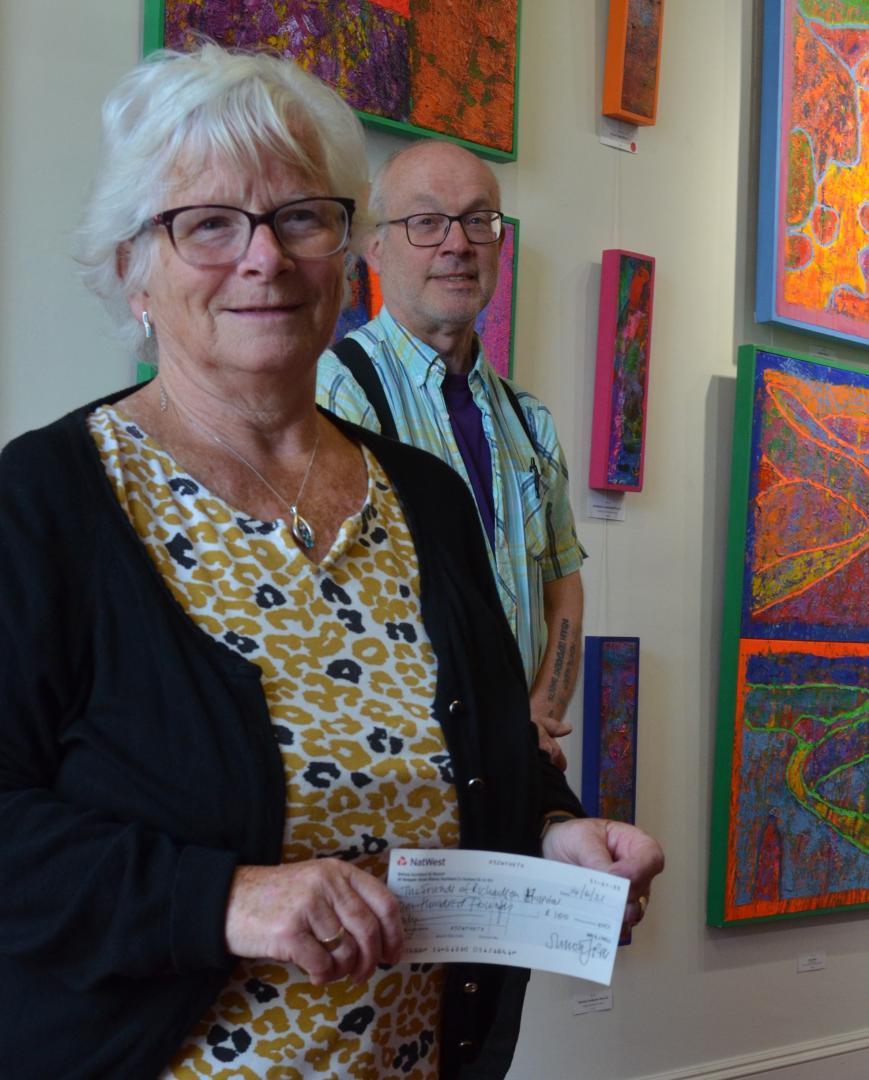 Town charity is quids in thanks to artist Simon