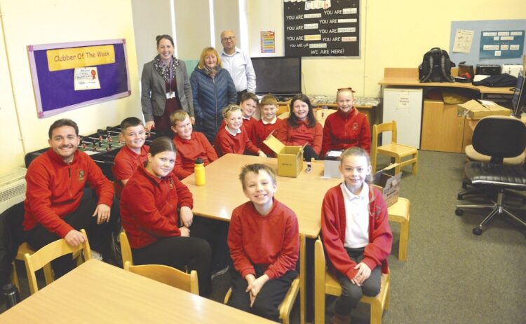 TOP GEAR: Headteacher Nicky Wright, Edge Hotel landlady Fiona Coastworth and Amit Kumar, from Cummins, with the year 5 group