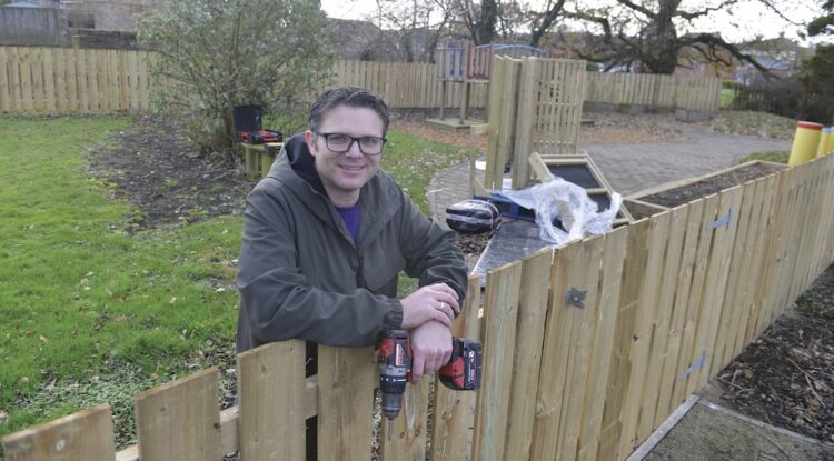 AT THE HELM: Centre manager John Bogle works to put together a picnic table for the wildlife wellbeing garden at the Randolph Centre TM pic