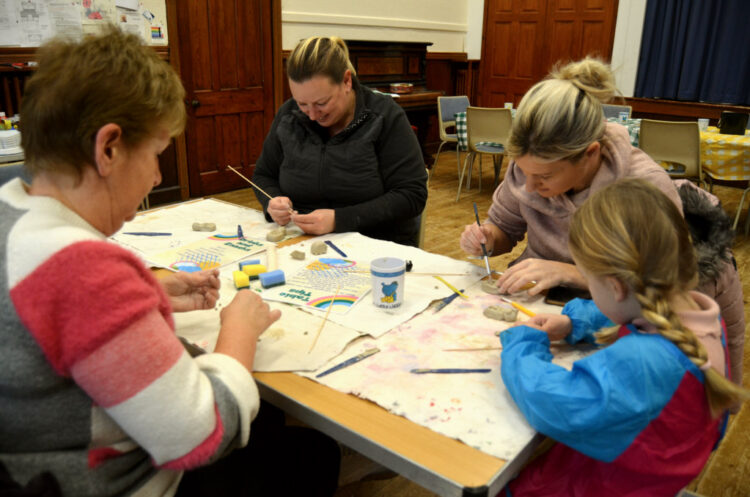 ART FOR ALL: Volunteers and youngsters were enthusiastic during the morning session