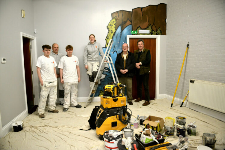 HARD AT WORK: Bishop Auckland College students Brennan Rose-Murgey and John George Proudfoot with Trades4Care directors Charlie Wright and Cameron Southworth and county councillors Richard Bell and Ted Henderson