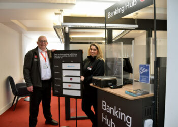OPEN FOR BUSINESS: The temporary banking hub is now open. Pictured are Post Office on-site trainer Keith Angus-Wall with banking hub operator Nikki Walia-France