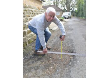 Repairs for road beset by potholes